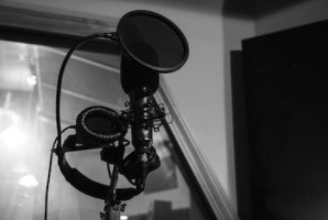 Recording in the Recording Booth with Neumann Recording Microphone and Sennheiser Headphones